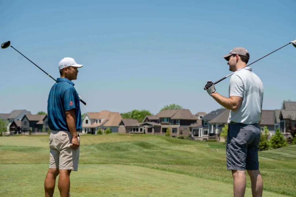 photo of two people playing golf