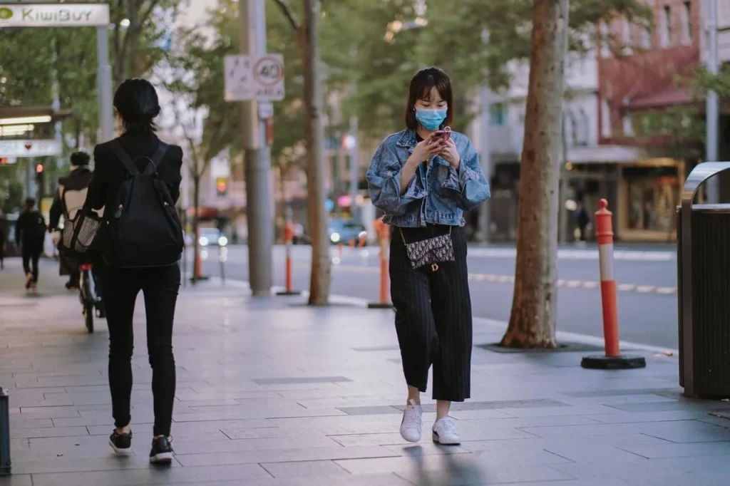 woman-walking-with-face-mask