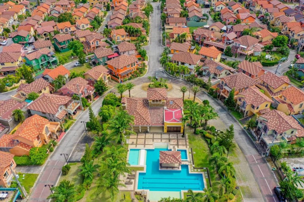 Aerial view of Ponticelli by Crown Asia in Bacoor, Cavite, showcasing Italian-inspired homes, lush greenery, and premium community amenities like a clubhouse and swimming pool—highlighting prime real estate properties investment opportunities in Cavite