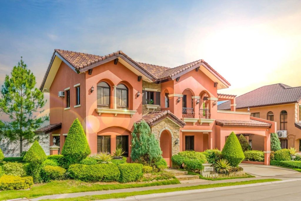 Exquisite Mediterranean-inspired house and lot for sale in Bacoor, Cavite, featuring landscaped greenery and premium design, highlighting prime real estate investment opportunities in Cavite